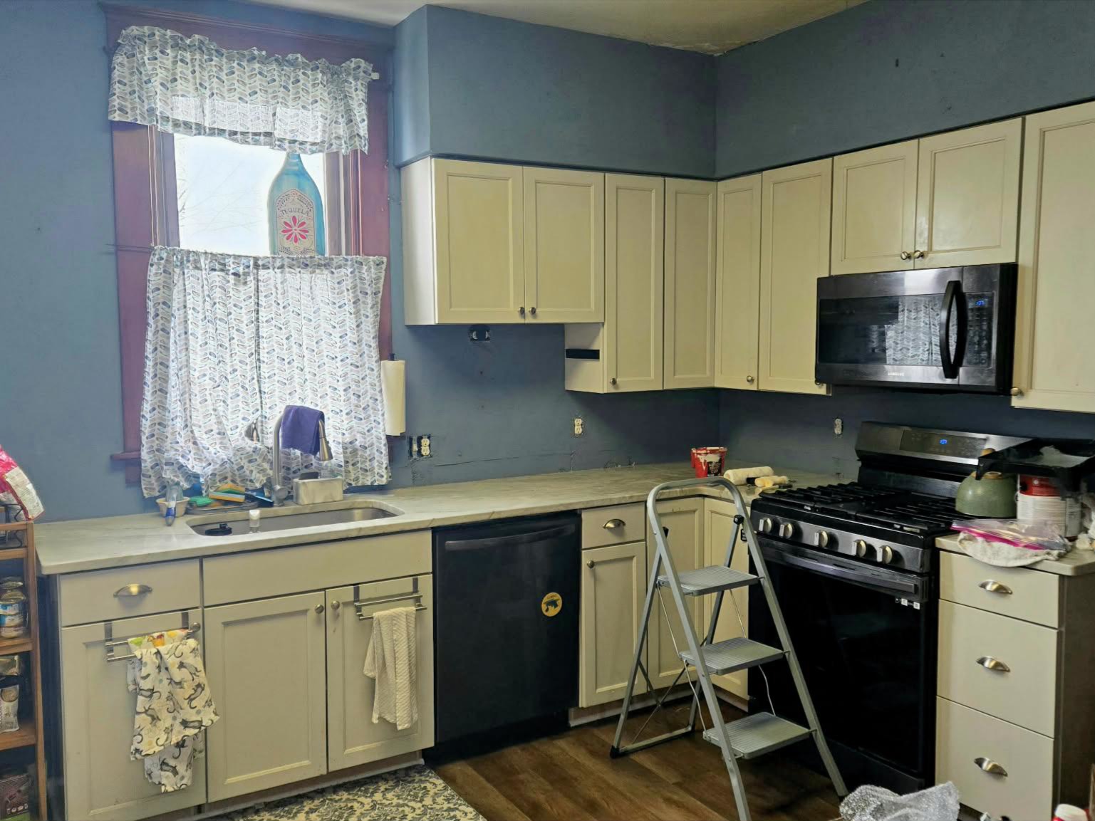 1910 kitchen mid renovation with Adirondack Blue paint and white cabinets